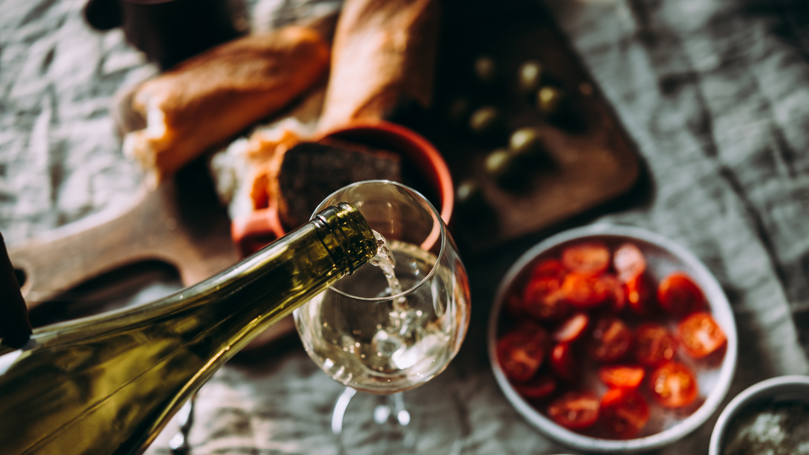 White wine being poured out into a glass