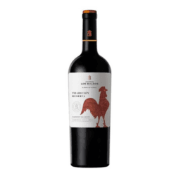 Bottle of Tradición Reserva Cabernet Sauvignon wine with a rooster design on the label.